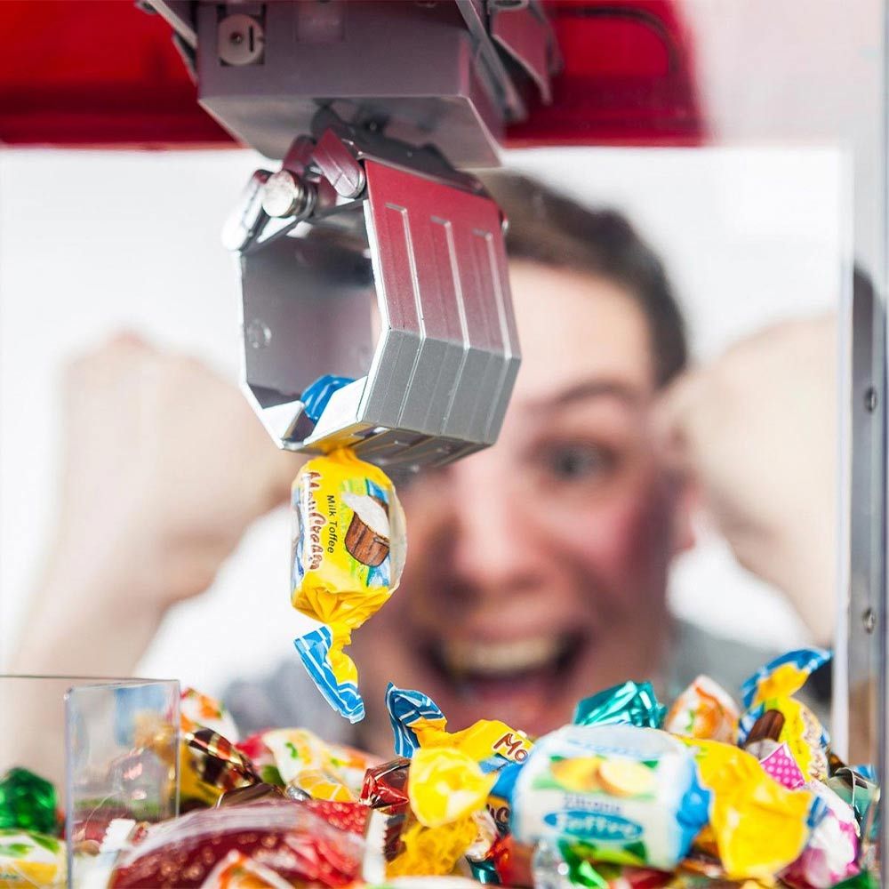 Aqbad Candy jew dispenser tal-magni tal-ġugarell biex taqbad ħelu jew ħelu